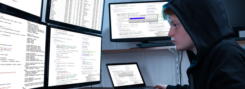 Software Engineer Degree Apprentice coding on multiple screens